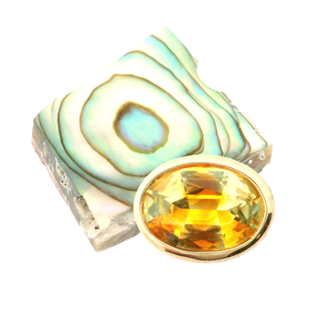 xx ct. yellow pear sapphire and abalone shell