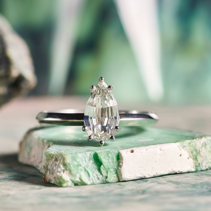 step cut white diamond pear cut engagement ring in white gold