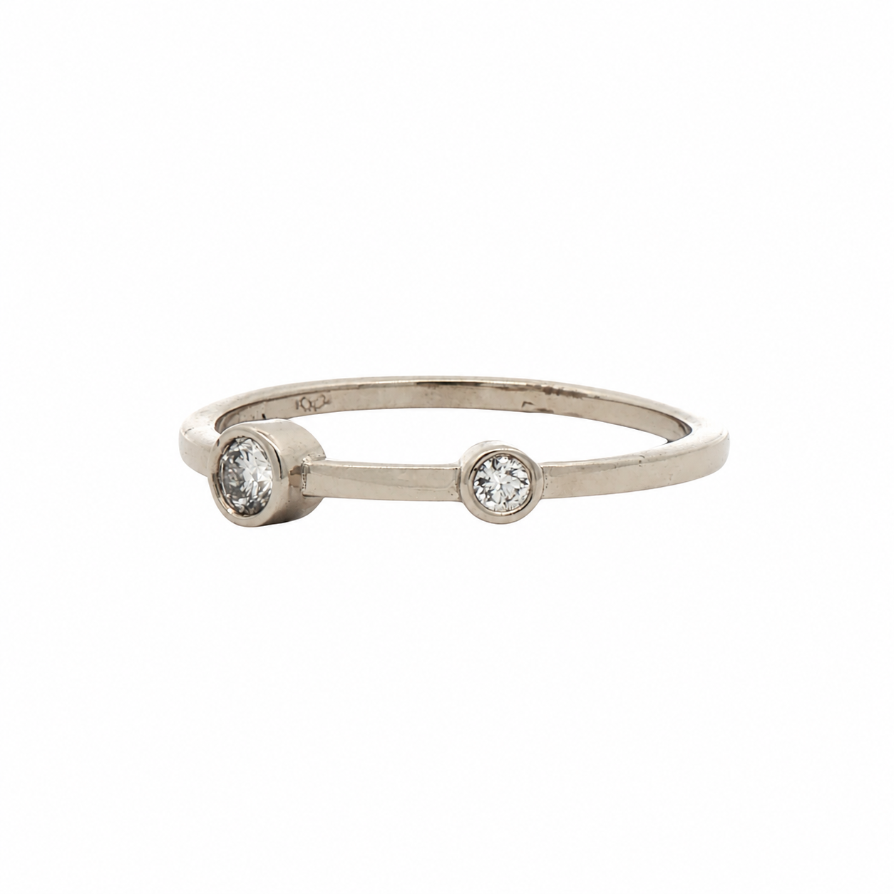 two white diamonds in a white gold band